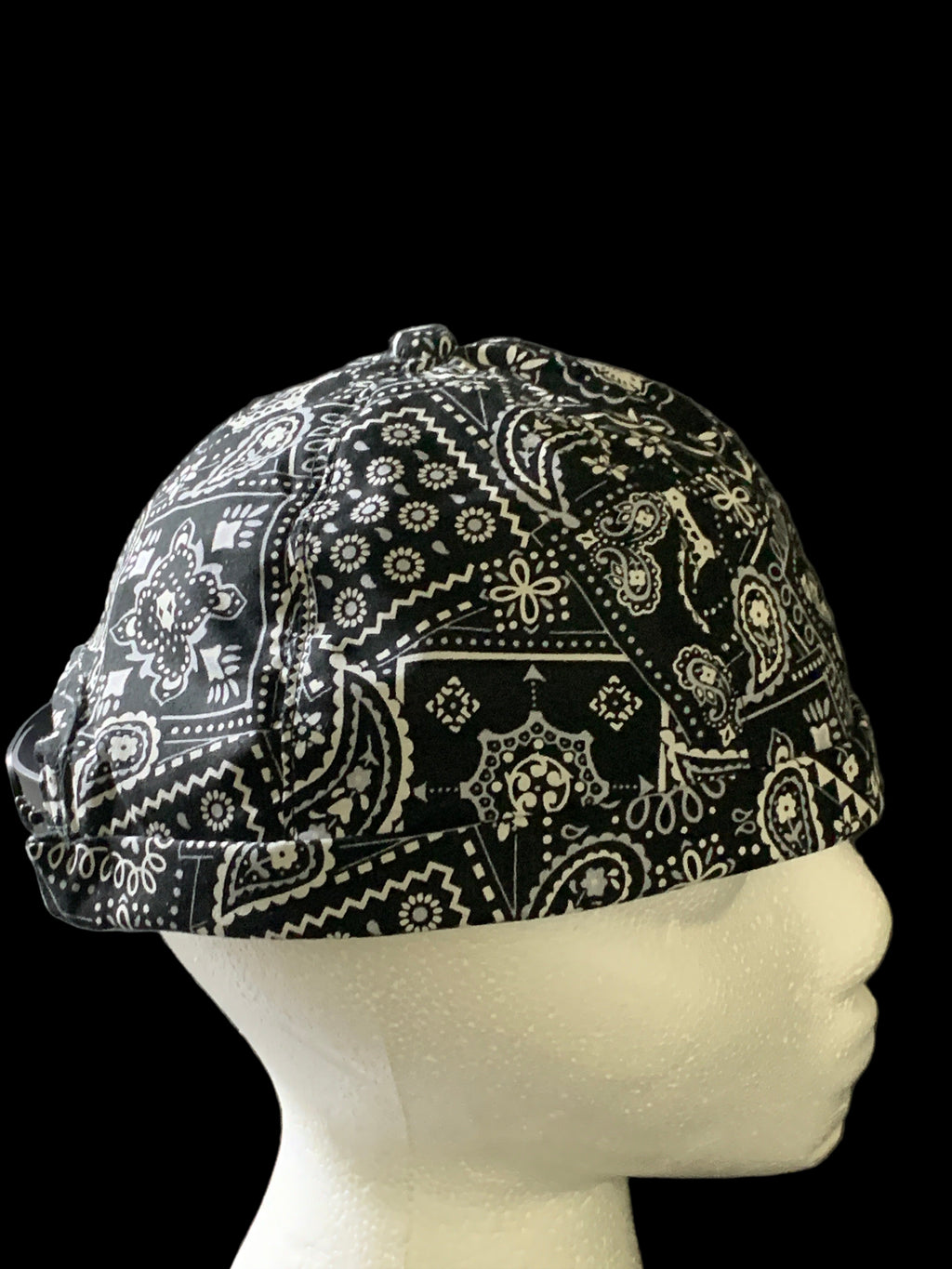 Black paisley fabric roll cap with black botton side view